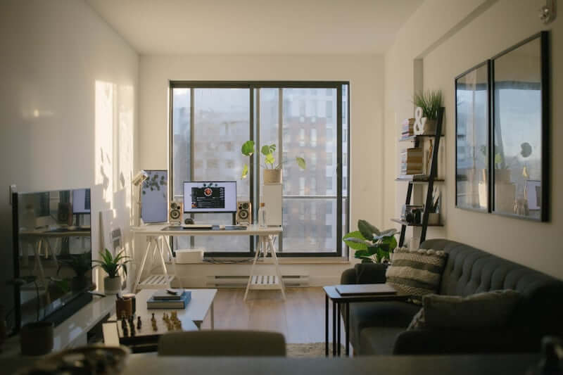 Small bright apartment room styled with simple small space design tricks