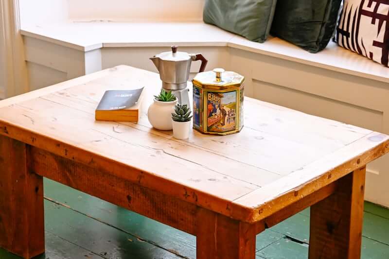 Styled coffee table vignette with grouped decor objects