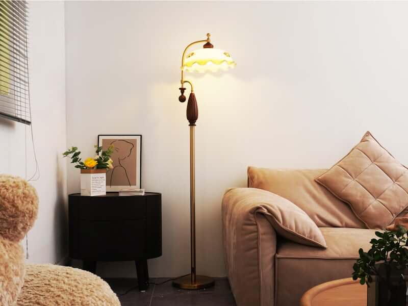 Living room with warm layered lamp lighting — no overhead light]