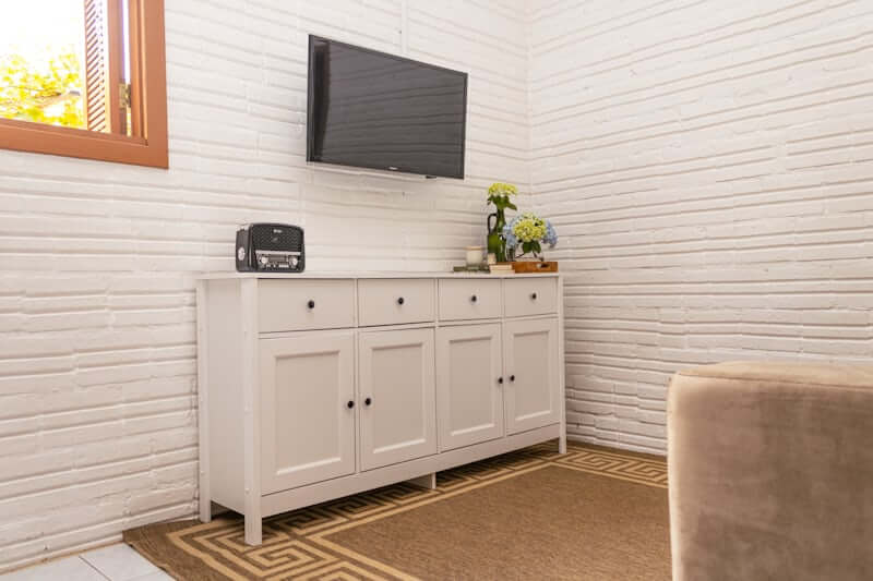 Storage ottoman doubling as a coffee table in a budget living room