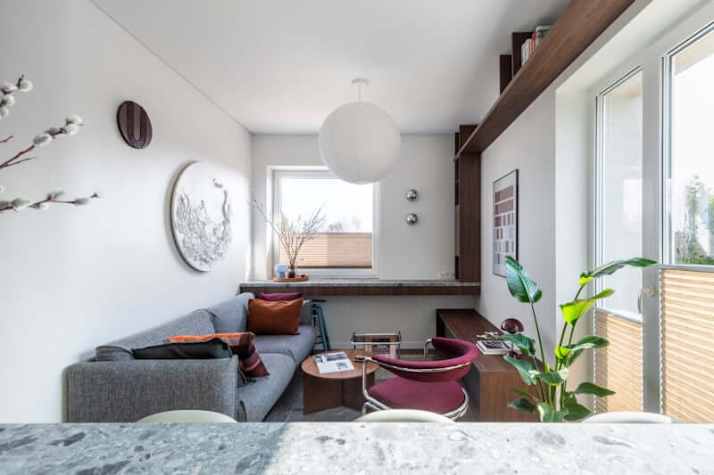 Vertical wall shelving maximizing storage in a small apartment