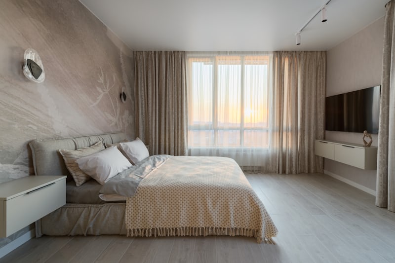 Minimalist bedroom with a tight color palette and warm tones