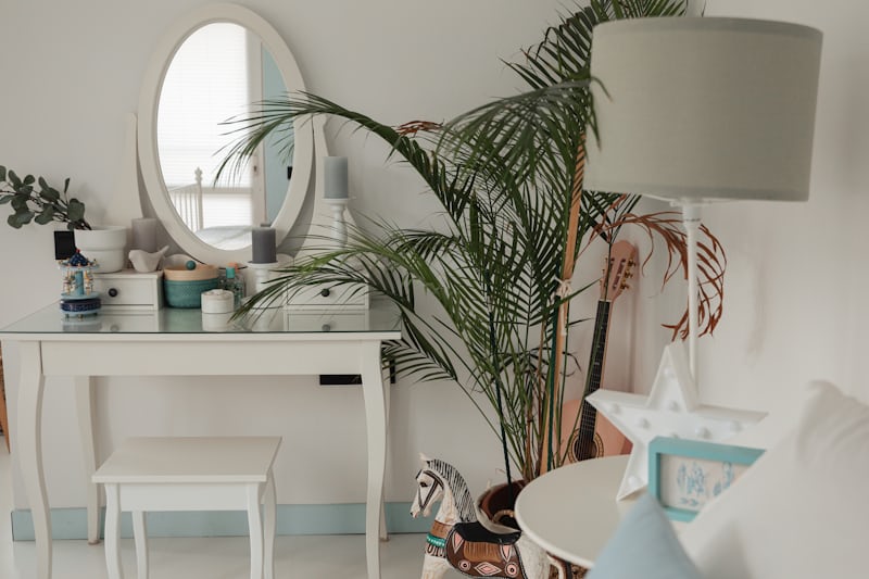 Tall plant in the corner of a bedroom adding height