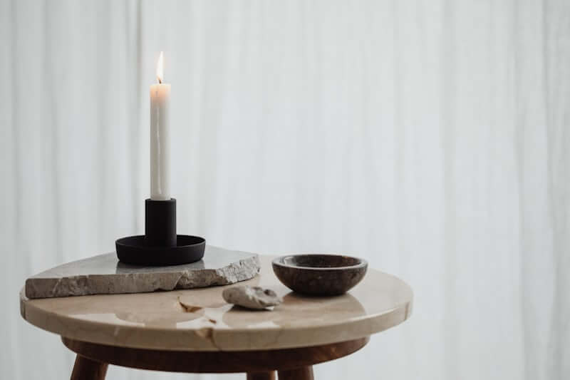 Candles adding warm ambiance to a styled coffee table