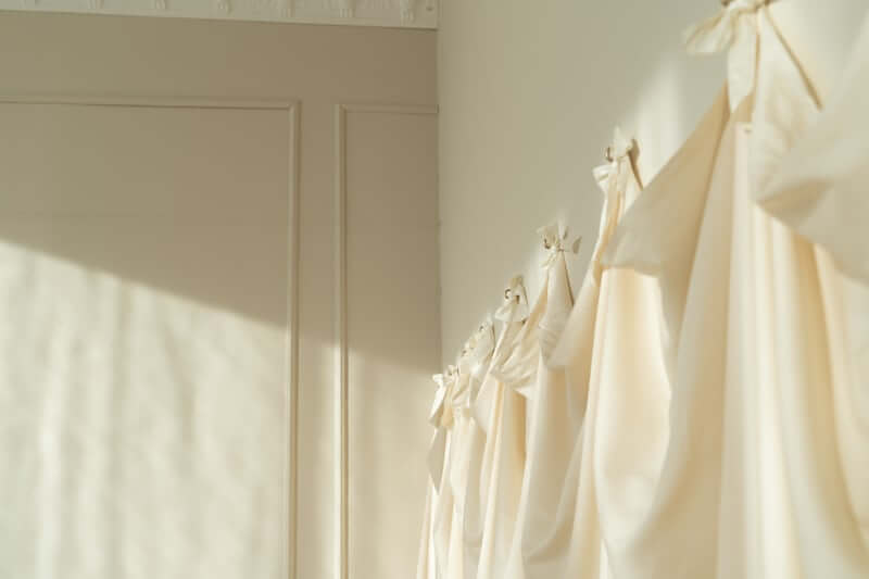 Curtain panel finished with pom-pom trim for a custom look