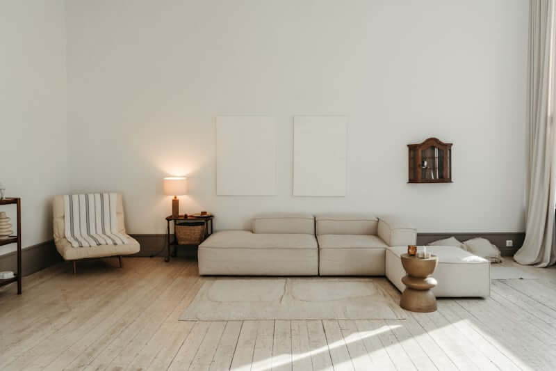 Minimalist small room layout with a clear walking path and light furnitu