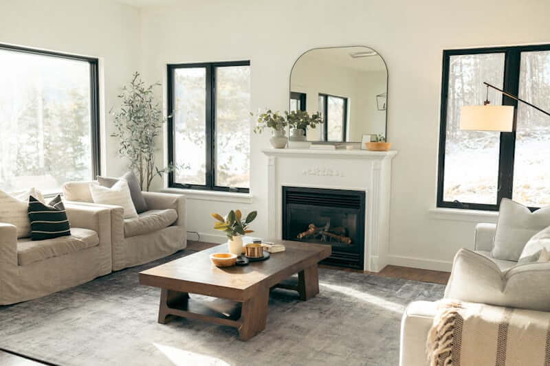 Plush neutral rug grounding a budget living room seating area