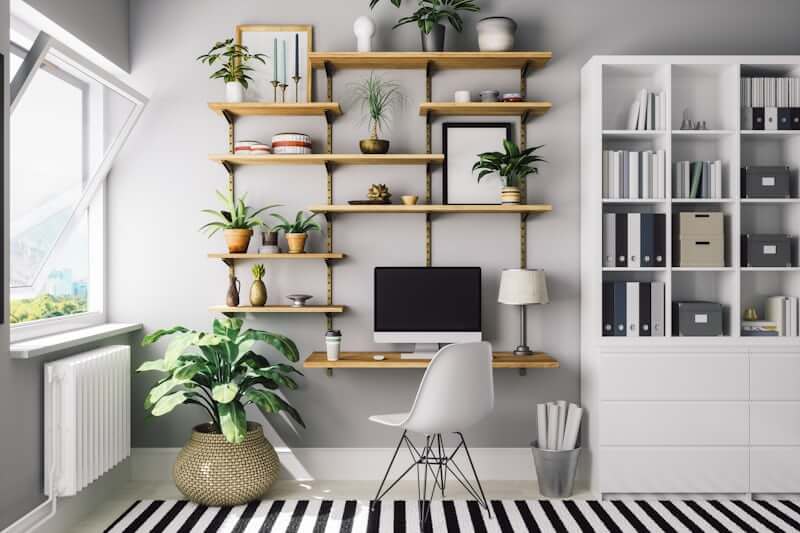 Tall narrow bookshelf drawing the eye upward in a small space